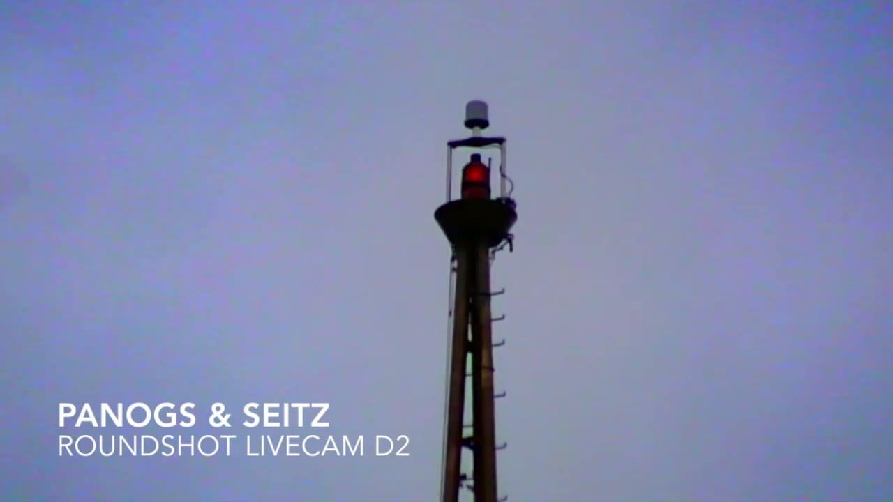 Title card reading Panogs & Seitz, Roundshot Livecam D2, mounted on the Space Needle's antenna structure