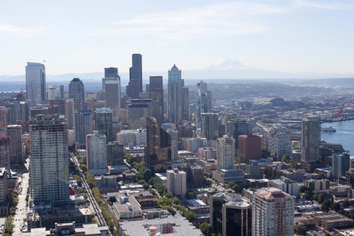 Aerial view of downtown Seattle from the Space Needle, Mount Rainier on the horizon